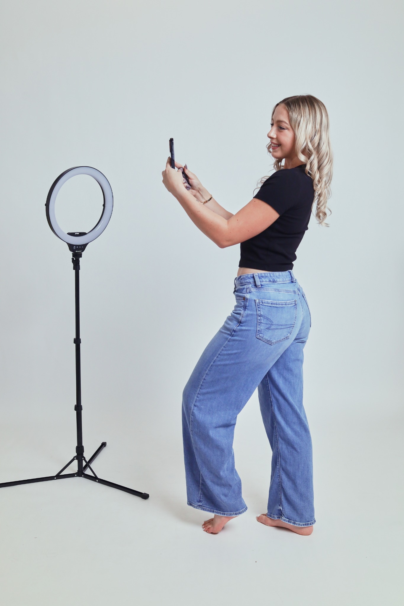 Seen & Sought founder Emma Thompson creating social content with her phone